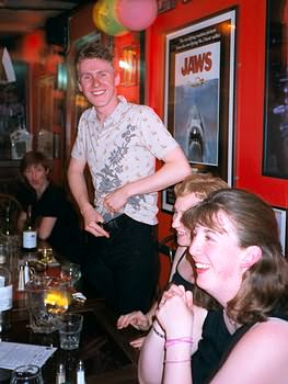 Stuart undoing his flies.