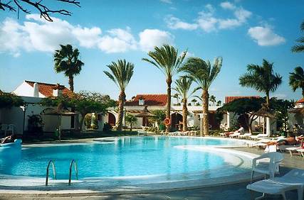 The pool outside our apartment, with palm trees and things...