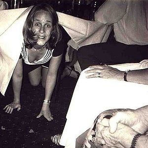 Rachel up to no good under the table.