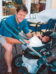 Dan with Raffy on a day out, aged 3 weeks.